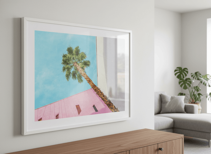Modern wall art styled above a sofa in a neutral living room