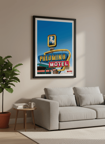 Modern wall art styled above a sofa in a neutral living room