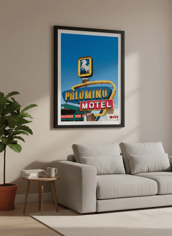 Modern wall art styled above a sofa in a neutral living room