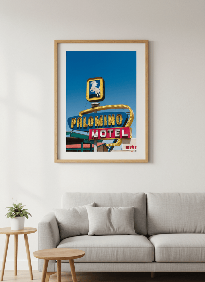 Modern wall art styled above a sofa in a neutral living room