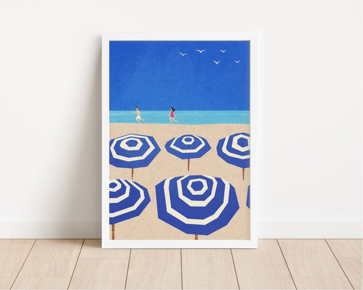 blue and white parasol artwork leaning against wall