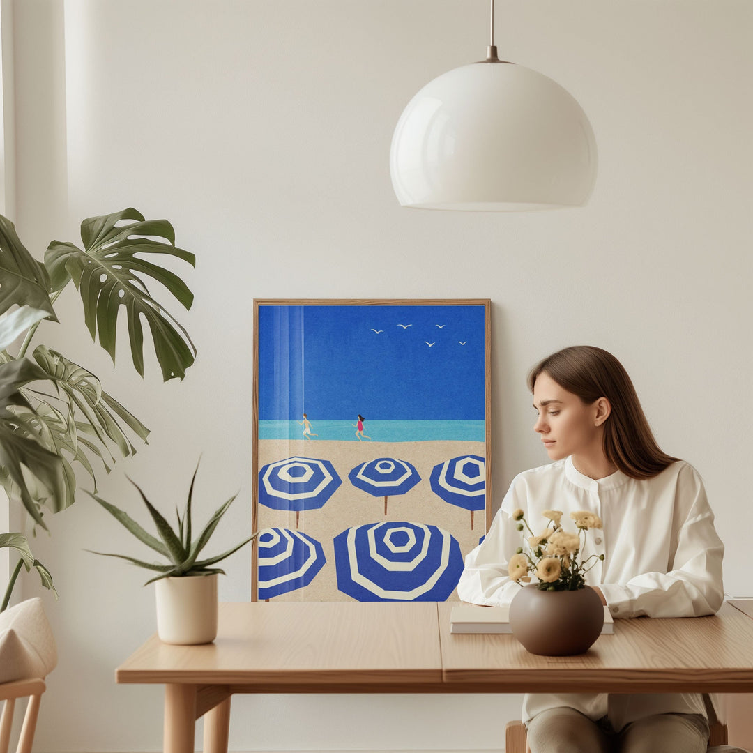 girl sitting on dining table with artwork of blue and white parasol on background