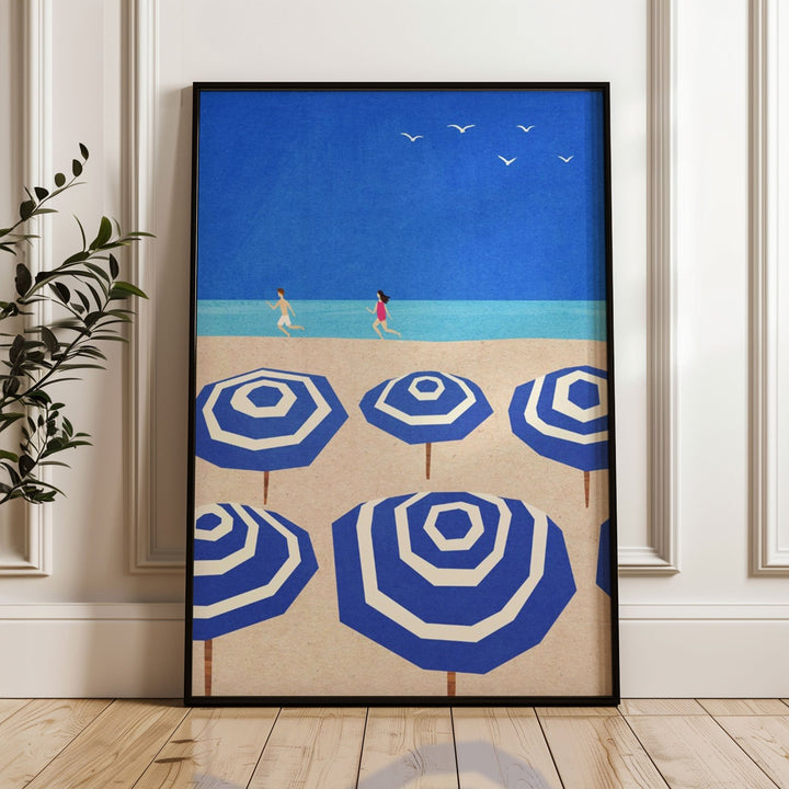 blue and white parasols artwork leaning against wall