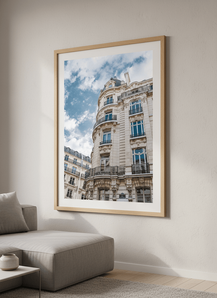 Modern wall art styled above a sofa in a neutral living room