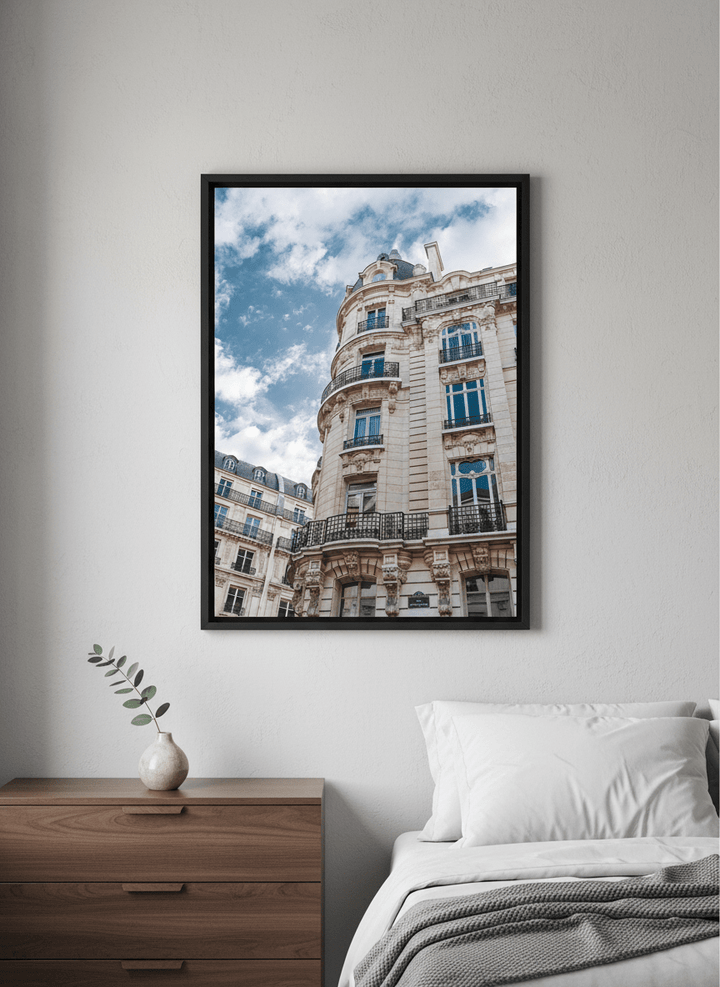 Minimalist artwork displayed in a calm, light-filled bedroom interior