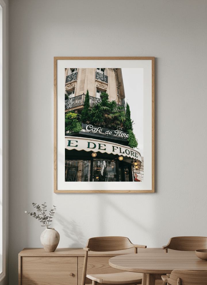 Wall art styled above a dining table in a contemporary home