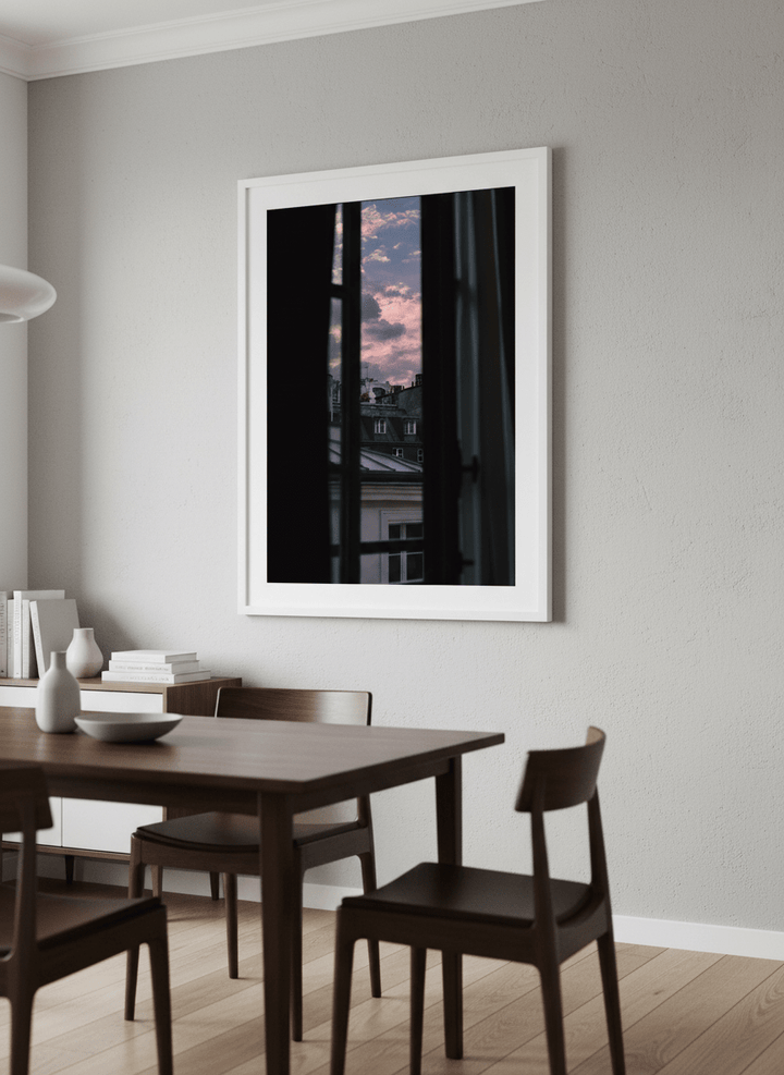 Wall art styled above a dining table in a contemporary home
