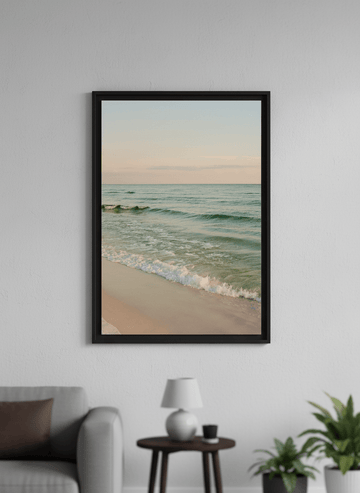 Modern wall art styled above a sofa in a neutral living room