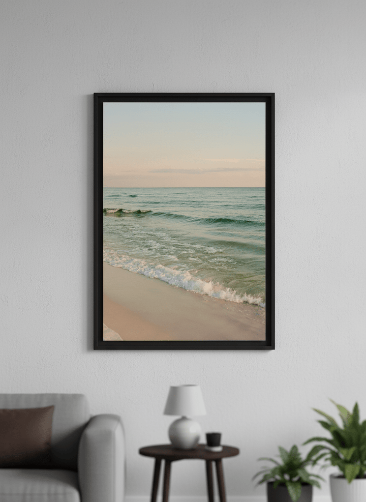 Modern wall art styled above a sofa in a neutral living room