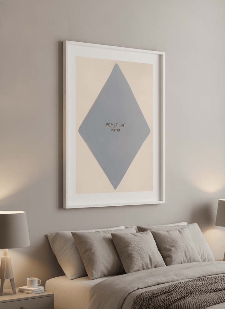 Minimalist artwork displayed in a calm, light-filled bedroom interior