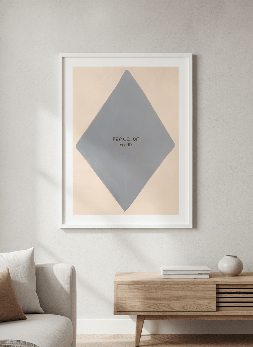 Modern wall art styled above a sofa in a neutral living room