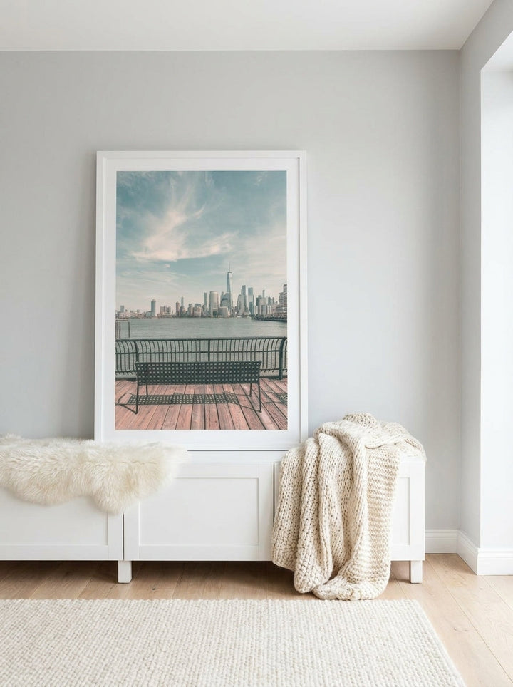 Modern wall art print standing on a sideboard in a bright Scandinavian bedroom