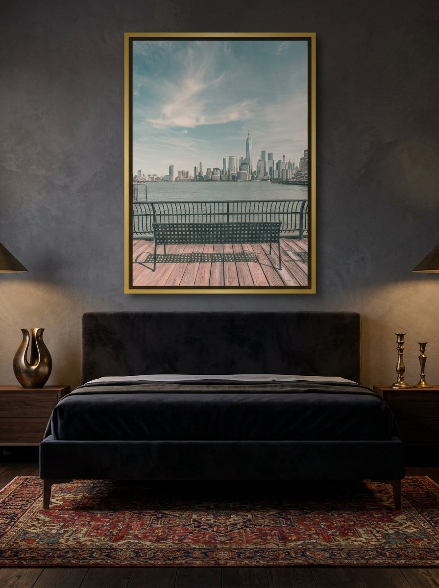 Canvas wall art with a gold leaf surround styled on the wall in a moody bedroom
