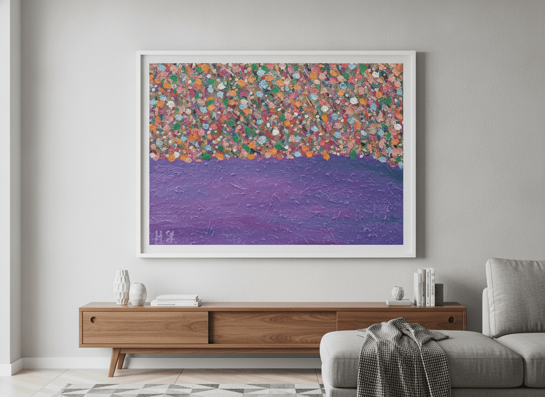 Modern wall art styled above a sofa in a neutral living room
