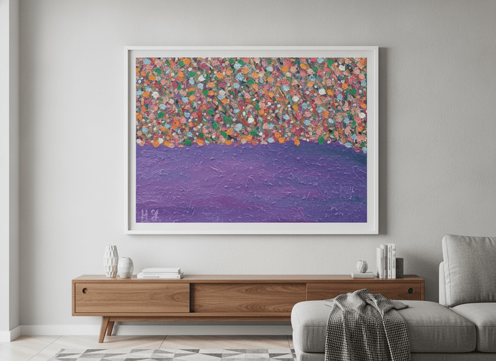 Modern wall art styled above a sofa in a neutral living room