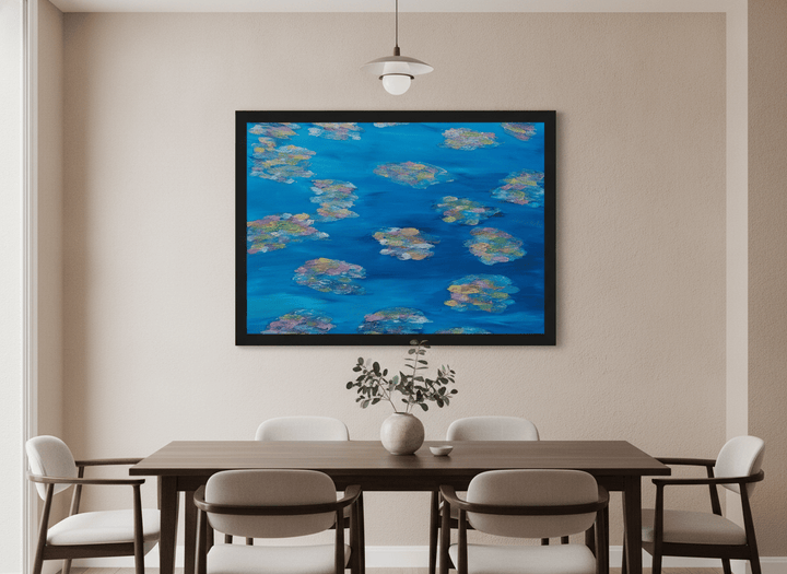 Wall art styled above a dining table in a contemporary home