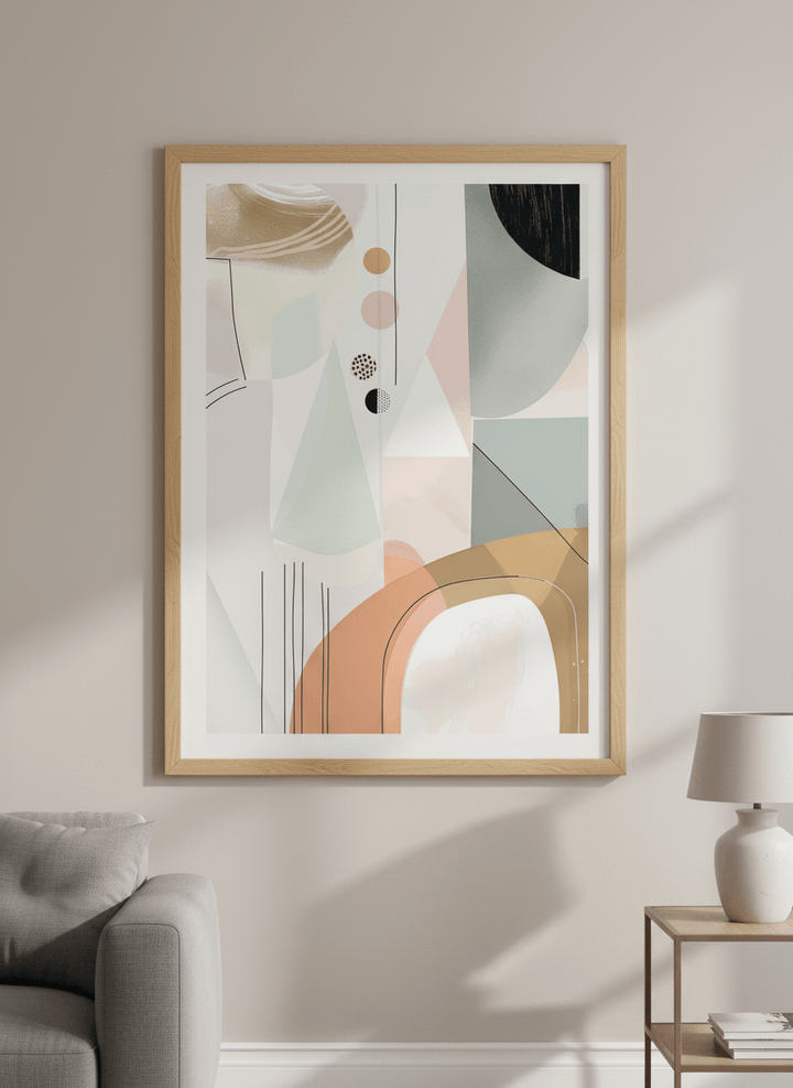 Modern wall art styled above a sofa in a neutral living room