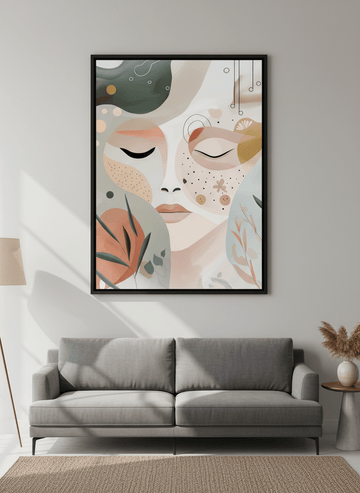 Modern wall art styled above a sofa in a neutral living room