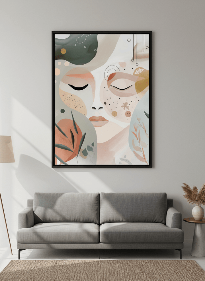 Modern wall art styled above a sofa in a neutral living room