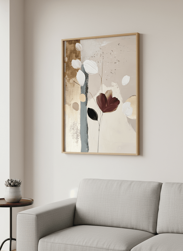Modern wall art styled above a sofa in a neutral living room
