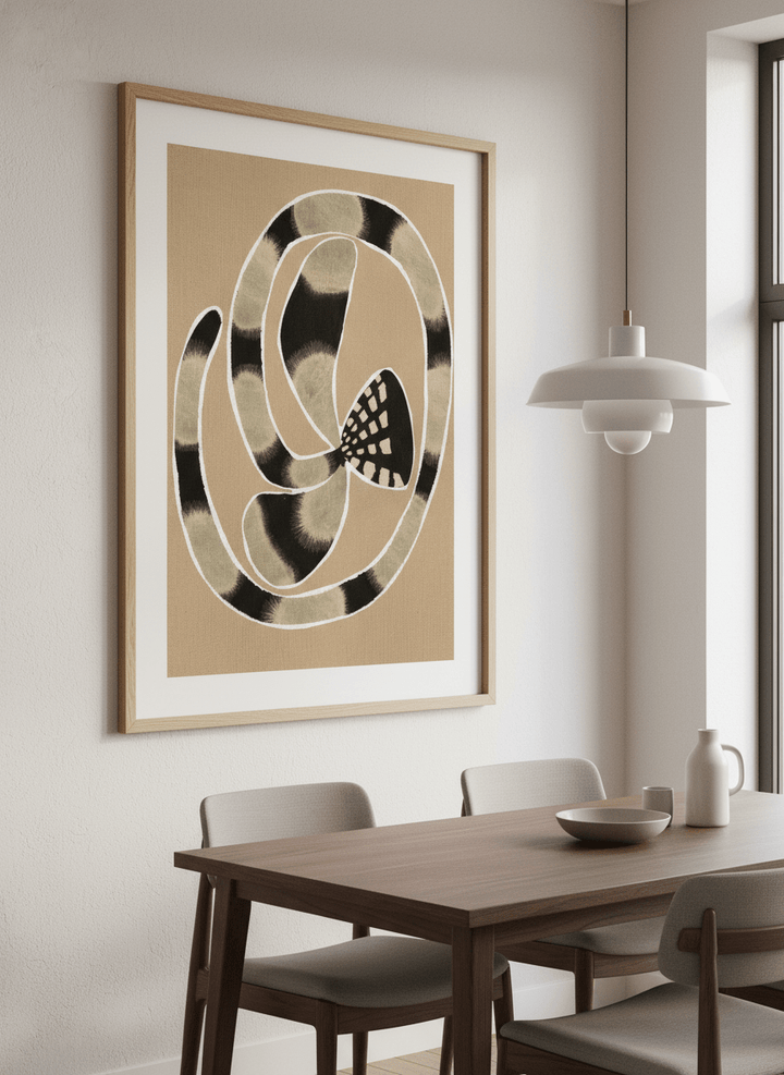 Wall art styled above a dining table in a contemporary home