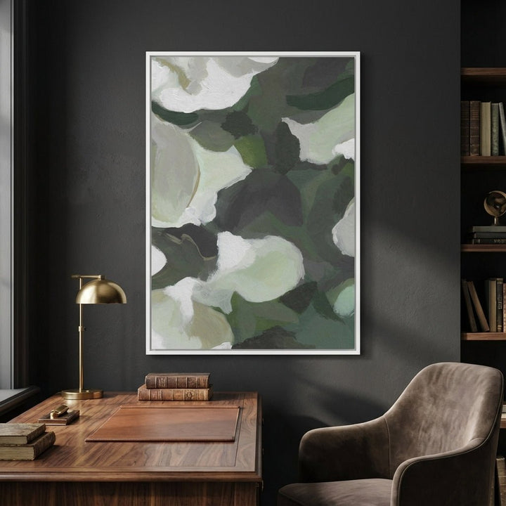 Abstract art print on a dark wall above a wooden desk with a chair.