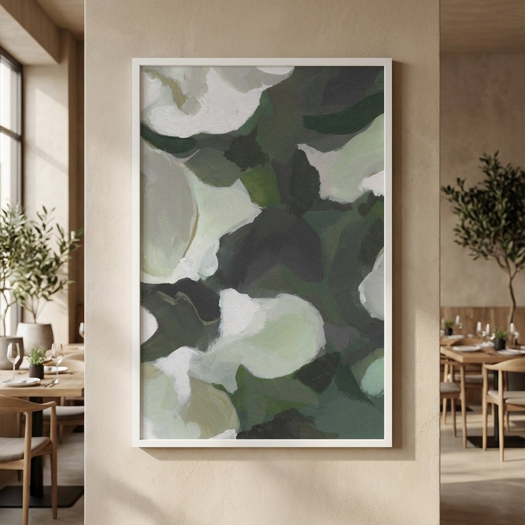 Abstract art print with green and white colors in a modern interior setting.