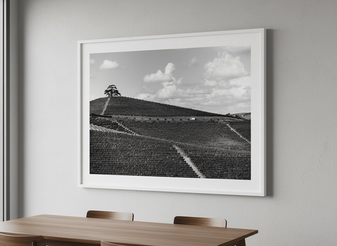 Wall art styled above a dining table in a contemporary home