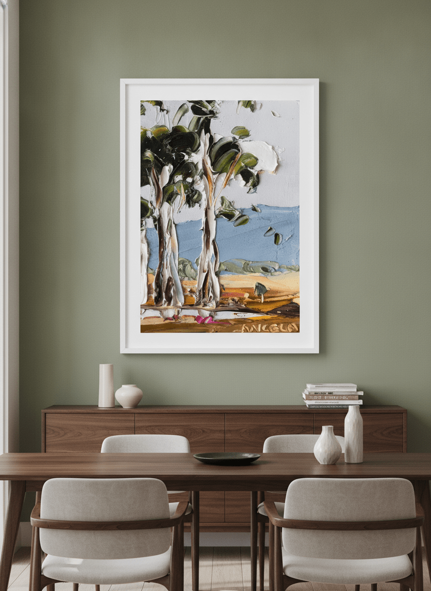 Wall art styled above a dining table in a contemporary home
