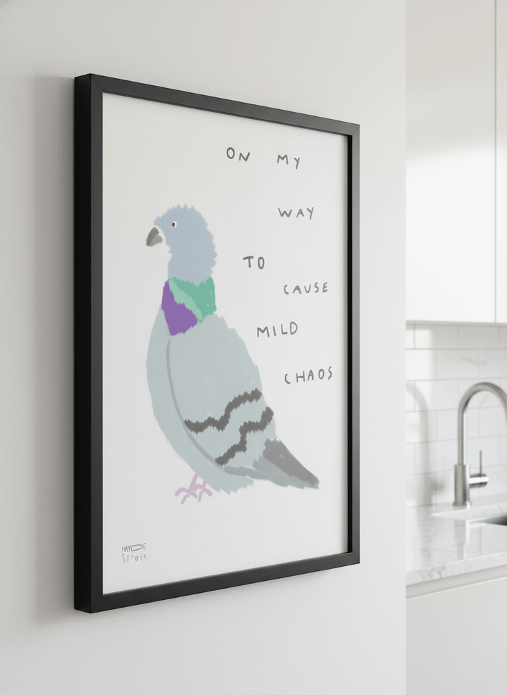 Artwork styled on the wall of a bright modern kitchen
