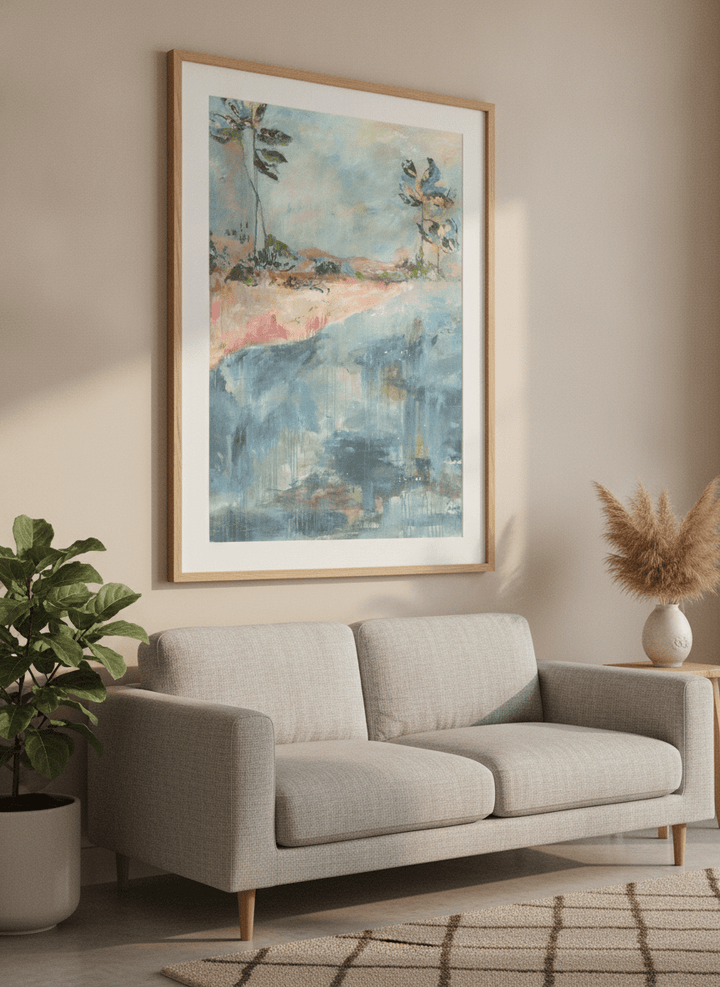 Modern wall art styled above a sofa in a neutral living room