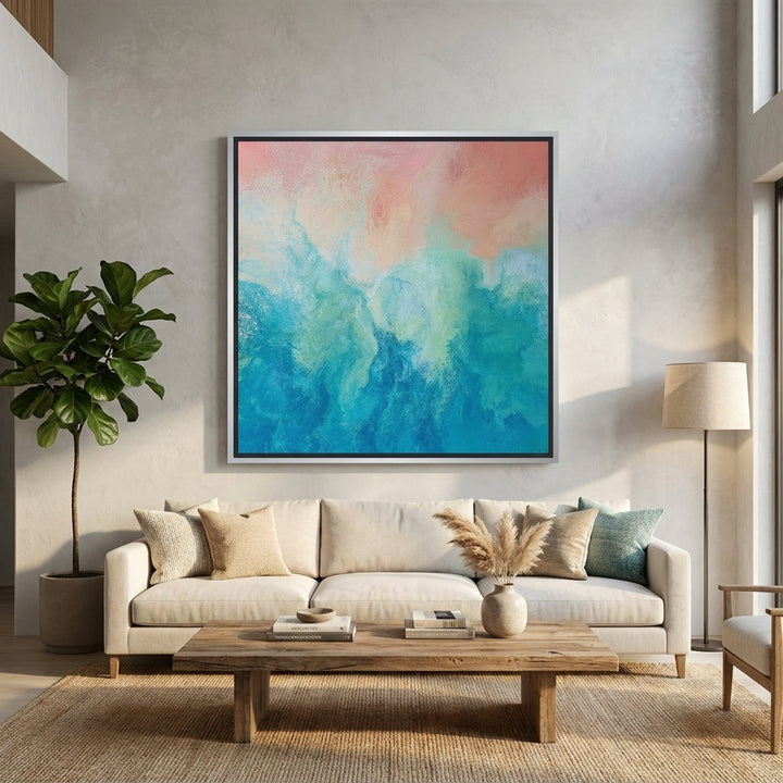 Oversized statement canvas wall art with a silver leaf surround styled in a neutral living room