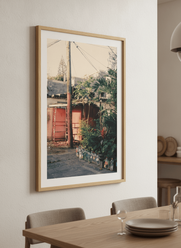 Wall art styled above a dining table in a contemporary home