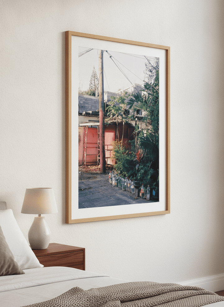 Minimalist artwork displayed in a calm, light-filled bedroom interior