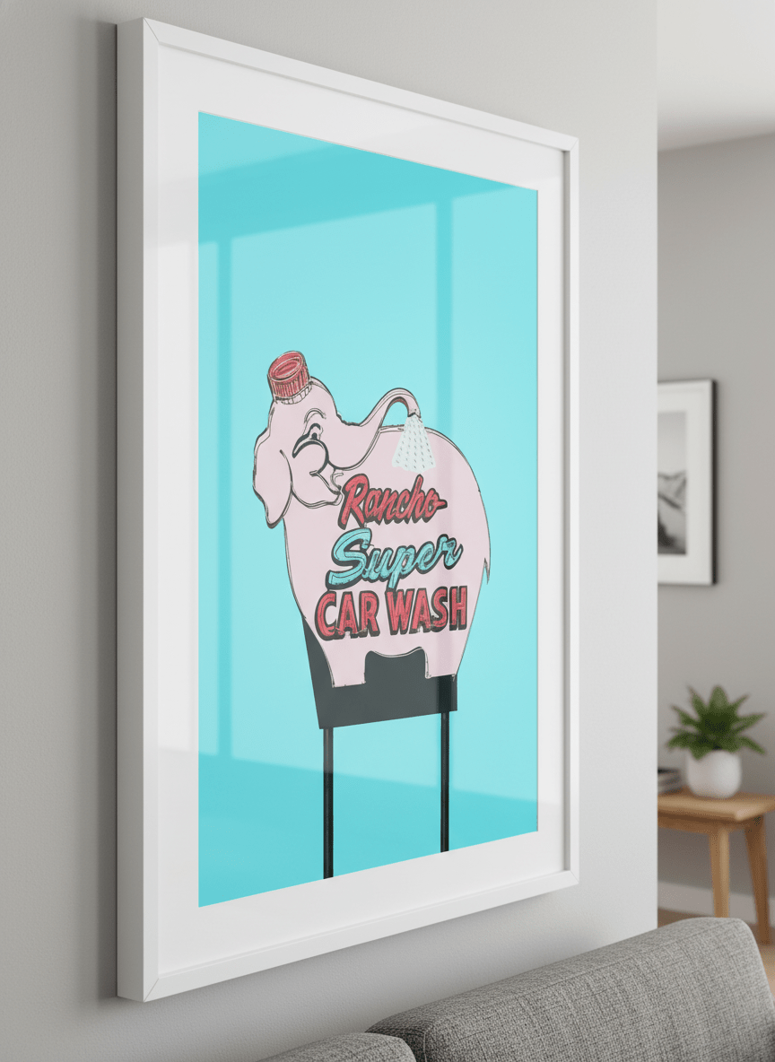Modern wall art styled above a sofa in a neutral living room
