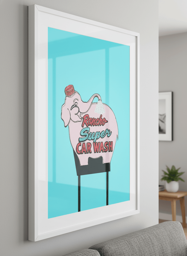 Modern wall art styled above a sofa in a neutral living room