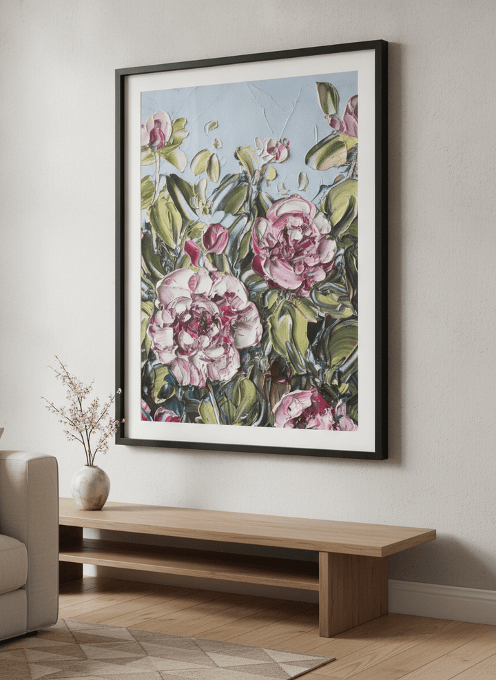 Modern wall art styled above a sofa in a neutral living room