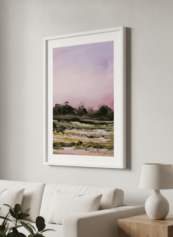 Modern wall art styled above a sofa in a neutral living room
