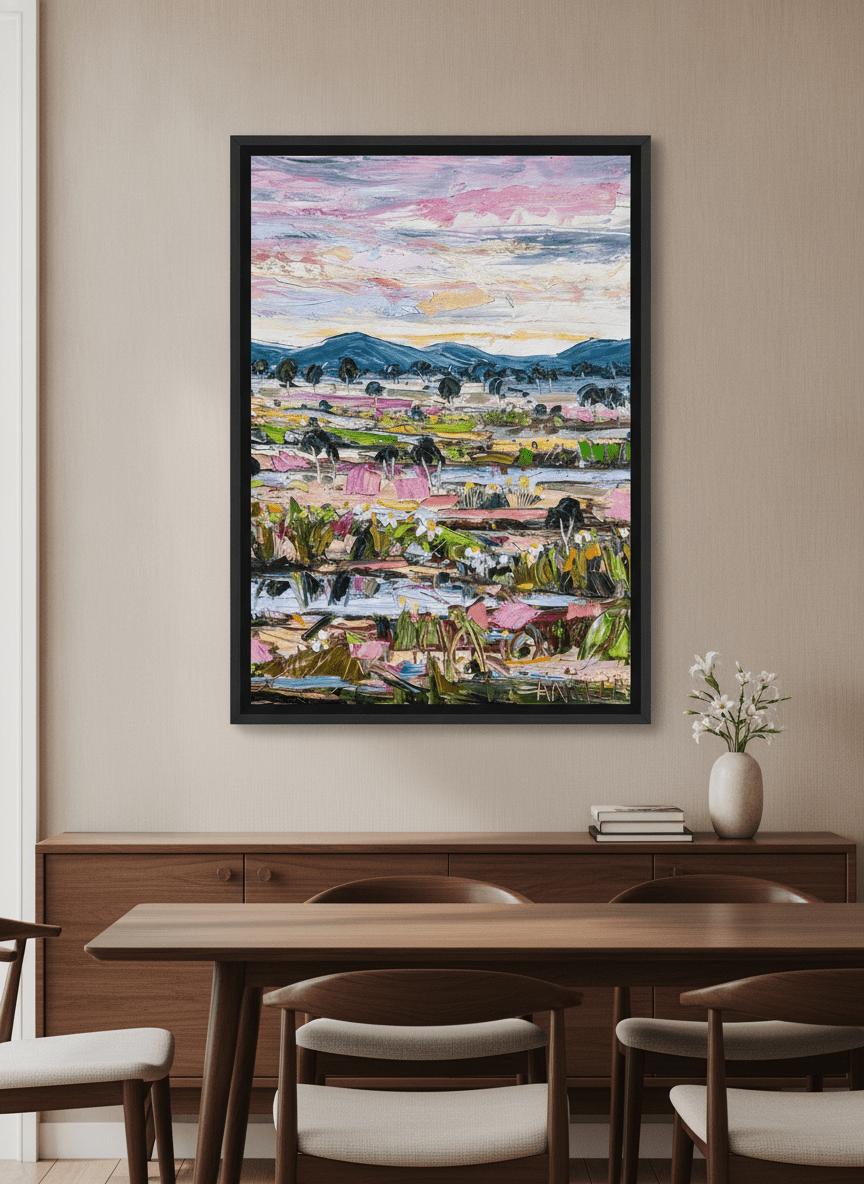 Wall art styled above a dining table in a contemporary home
