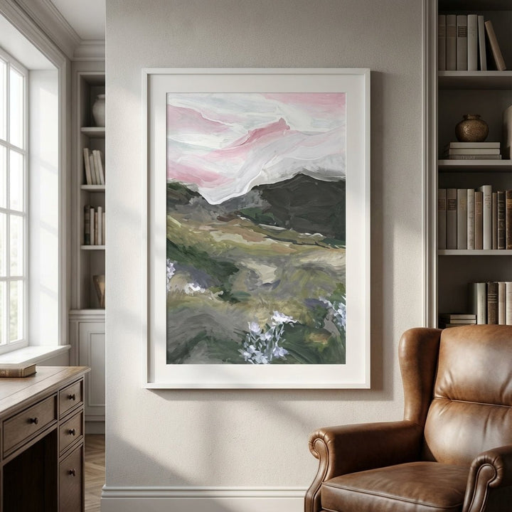 abstract painting on a wall above a brown leather armchair in a room with bookshelves.