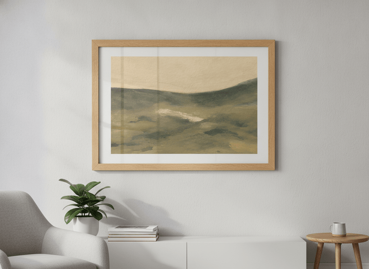 Modern wall art styled above a sofa in a neutral living room