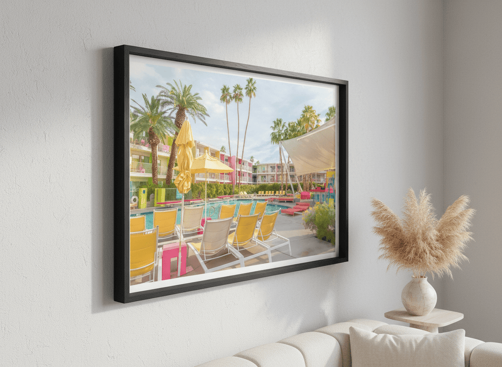 Modern wall art styled above a sofa in a neutral living room