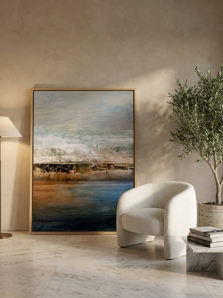 Oversized statement canvas wall art with a natural timber surround leaning against the wall in a luxe dining room