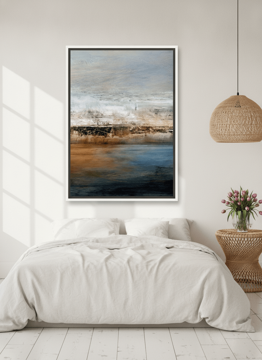 Canvas wall art with a white surround styled on the wall in a bright Scandinavian bedroom