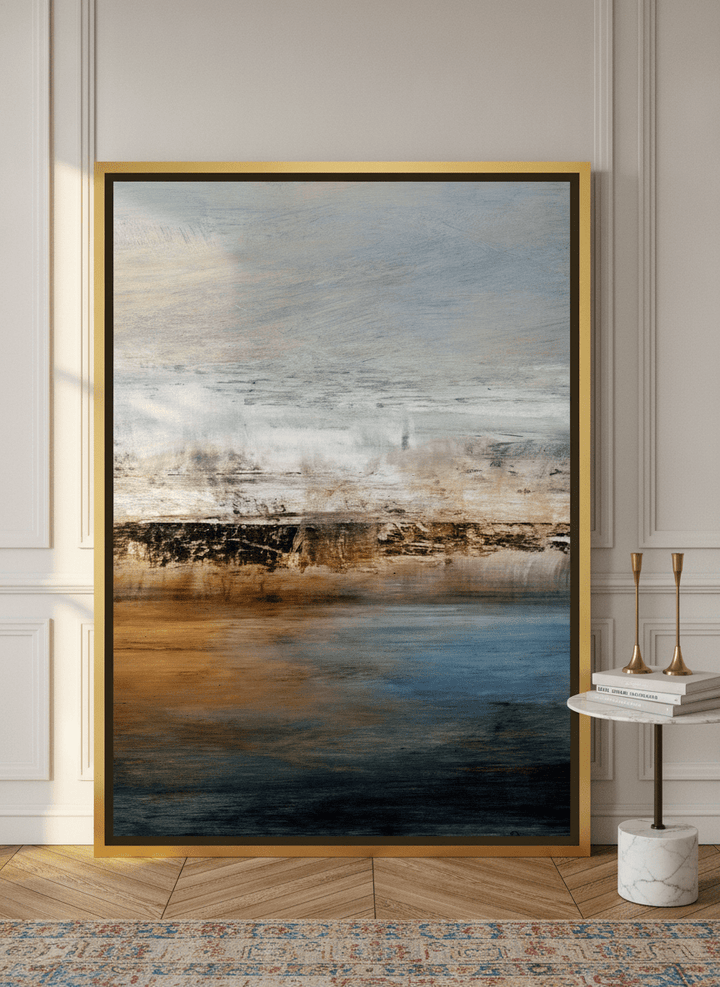 Canvas wall art with a gold leaf surround leaning against the wall in a Parisian home office
