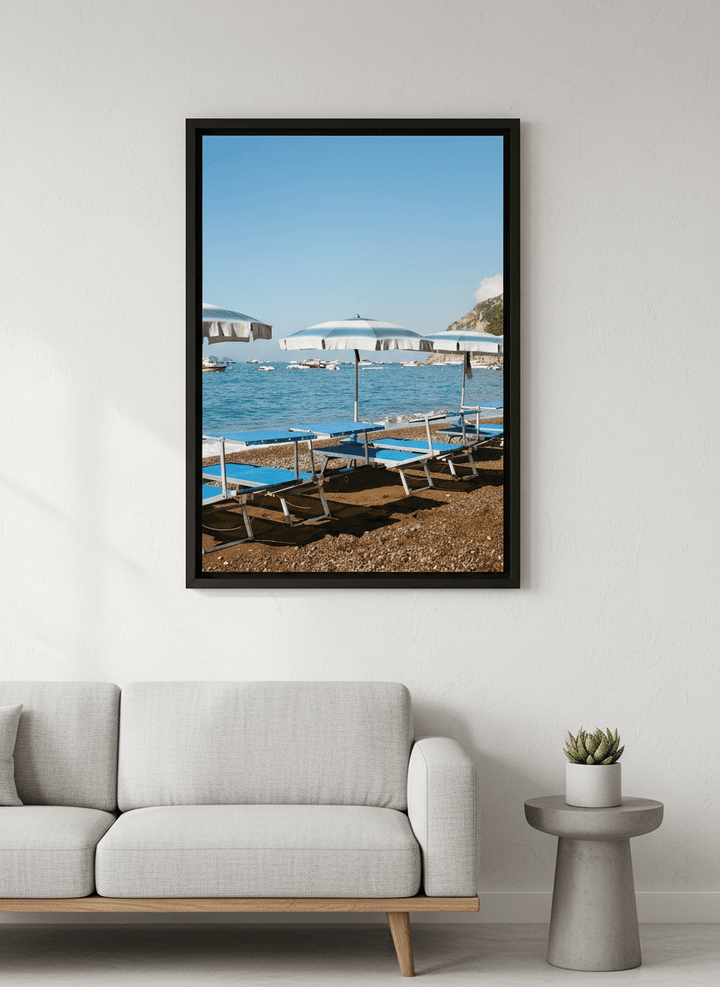 Modern wall art styled above a sofa in a neutral living room