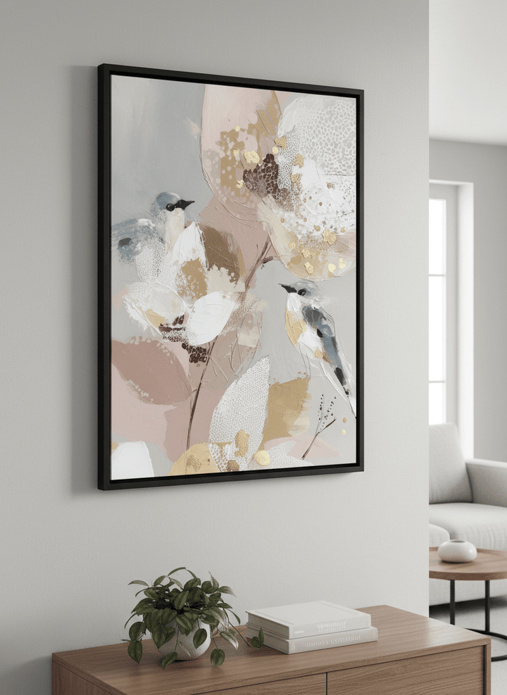 Modern wall art styled above a sofa in a neutral living room
