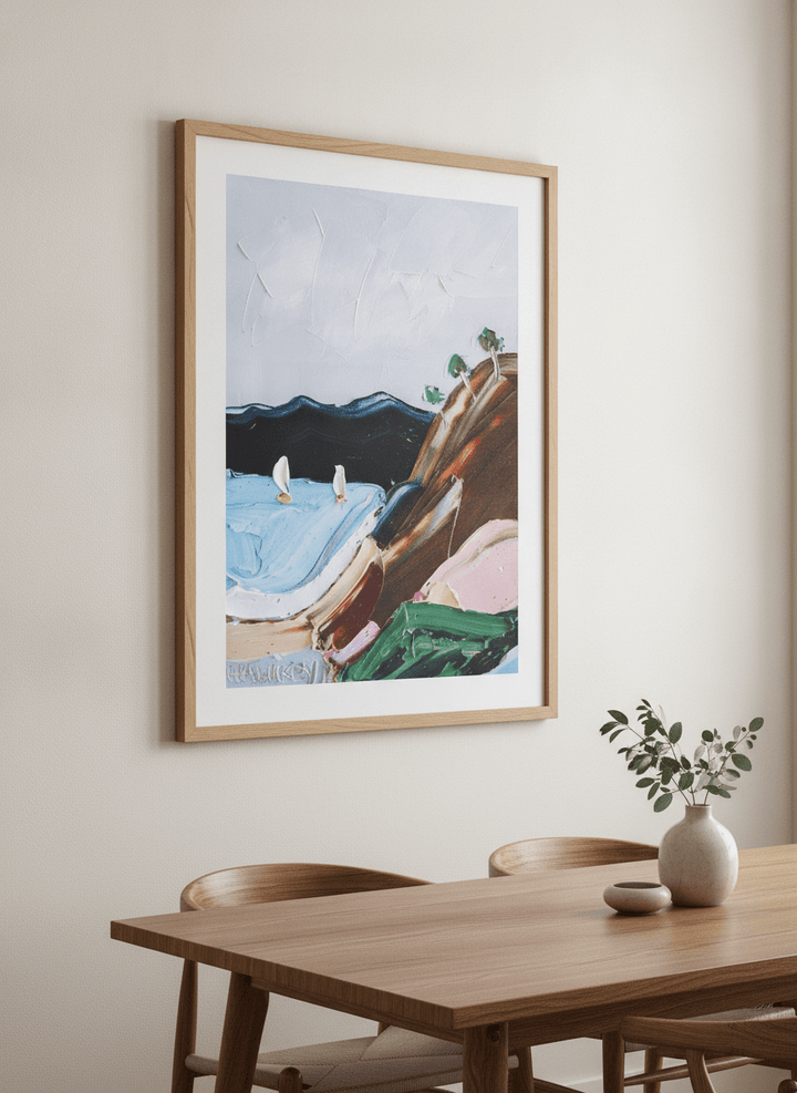 Wall art styled above a dining table in a contemporary home