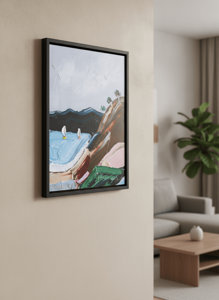 Modern wall art styled above a sofa in a neutral living room