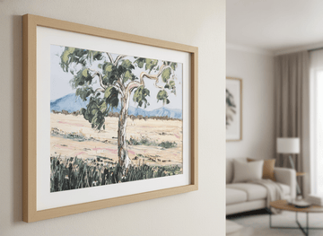 Modern wall art styled above a sofa in a neutral living room